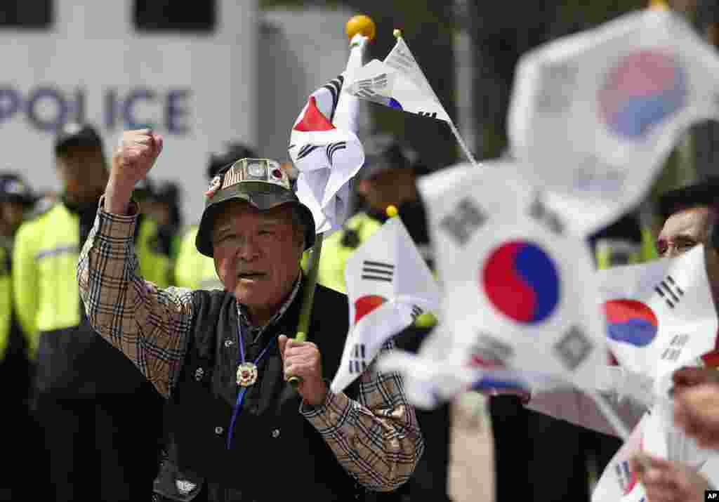 South Korean conservative activists shout slogans as police block them from attempting to release balloons with leaflets during a rally at the border city with North Korea, in Paju, South Korea. A North Korean launch of a missile on the birthday of its revered founder appears to have failed, South Korean and U.S. defense officials said Friday.