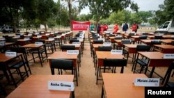 FILE - Names of missing Chibok schoolgirls kidnapped by Boko Haram insurgency five years ago are displayed in Abuja, Nigeria, April 14, 2019. 