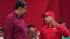 FILE - Venezuelan President Nicolas Maduro, left, speaks with Pedro Tellechea, then the oil minister and president of the Venezuelan state oil company PDVSA, in Caracas, Venezuela, May 1, 2023.