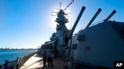 FILE - This Nov. 11, 2004, file photo shows The USS Missouri's main battery of three 16-inch/.05 caliber gun turrets in Pearl Harbor, Hawaii. 