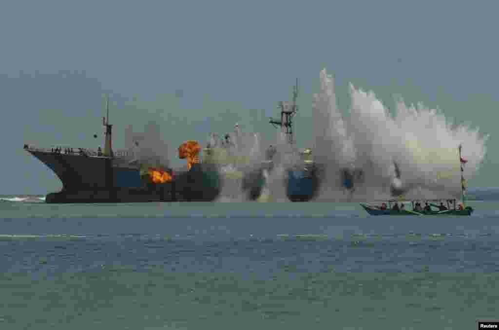 Indonesian Navy and the Ministry of Maritime Affairs and Fisheries blow up the illegal fishing vessel the MV Viking in the waters of Tanjung Batumandi, Pangandaran, West Java in this photo taken by Antara Foto.