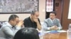 Investors from China meet in a conference room to discuss investment opportunities, green cards and other pertinent issues, in Lancaster, California, September 2011.