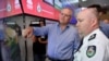 Australia's Prime Minister Scott Morrison is briefed by NSW RFS Commissioner Shane Fitzsimmons in the NSW Rural Fire Service control room in Sydney, Dec. 22, 2019.