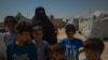 FILE - Thousands of children are detained at the Al-Hol camp with their mothers. Many of them are sons and daughters of IS fighters who died or are in prison. Aug. 26, 2019. (Yan Boechat/VOA)