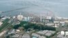 An aerial view shows Tokyo Electric Power Co. (TEPCO)'s tsunami-crippled Fukushima Daiichi nuclear power plant and its contaminated water storage tanks (bottom) in Fukushima, in this photo taken by Kyodo August 20, 2013. Japan's nuclear watchdog said on W