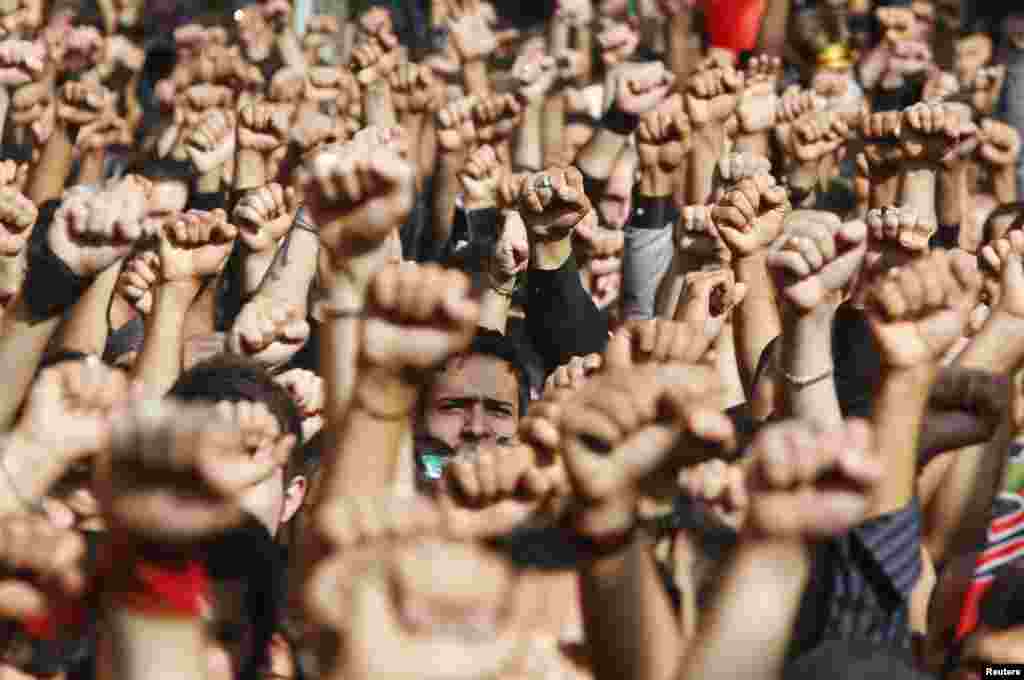 Lebanese Hezbollah supporters march during a religious procession to mark Ashura in Beirut's suburbs.