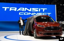 Actor Jim Belushi unveils the Ford Transit Connect Wagon at the 2018 Chicago Auto Show at McCormick Place in Chicago, Feb. 8, 2018. The 2019 Ford Transit Connect Wagon goes on sale this fall.