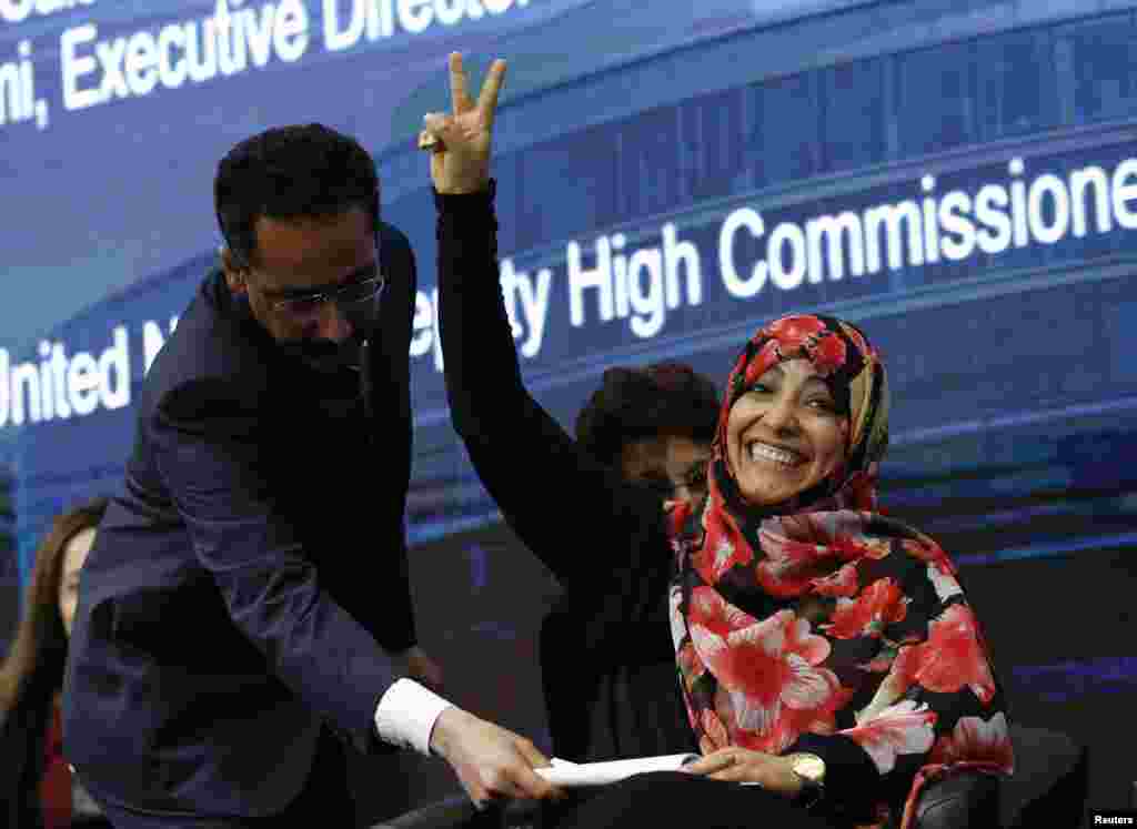 Yemeni journalist and Nobel Laureate Tawakkol Abdel-Salam Karman gestures before a panel discussion on human rights on the sidelines of the United Nations Human Rights Council in Geneva, Switzerland.