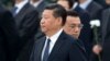 FILE - Chinese Premier Li Keqiang, right, walks past Chinese President Xi Jinping as they arrive to the Monument to the People's Heroes during a ceremony marking Martyr’s Day at Tiananmen Square in Beijing, Sept. 30, 2014. 