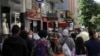 FILE - People walk along Tunali Hilmi Street, in Ankara, Turkey, June 3, 2020, days after the government lifted a series of restrictions imposed to fight the coronavirus pandemic. 