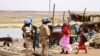 FILE - Senegalese soldiers of the U.N. peacekeeping mission in Mali MINUSMA (United Nations Multidimensional Integrated Stabilization Mission in Mali) patrol on foot in the streets of Gao, July 24, 2019, a day after a suicide bomb attack.