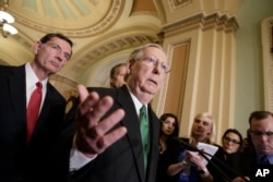 Senate Majority Leader Mitch McConnell of Ky., joined at left by Sen. John Barrasso, R-Wyo., speaks with reporters after meeting with Vice President Mike Pence as Republicans roll out their Obamacare replacement plan, March 7, 2017.