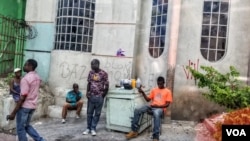 Haitians are seen gathered on a street corner in Petionville. (S. Lemaire/VOA)