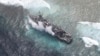 FILE - The USS Guardian, a U.S. Navy minesweeper, is seen at the Vicinity of South Islet in Tubbataha Reefs after it ran aground in Palawan province, west of Manila January 19, 2013 in this handout picture distributed by the Armed Forces of the Philippine