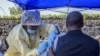 A man receives a vaccine against Ebola from a nurse outside the Afia Himbi Health Center on July 15, 2019 in Goma.