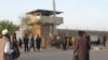 FILE - Pakistan army soldiers and other security officials surround a central jail in Bannu, 170 kilometers south of Peshawar, Pakistan. Taliban militants battled their way into this prison in 2012, freeing close to 400 prisoners.