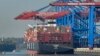 FILE - A container ship is loaded at the harbor in Hamburg, Germany, Oct. 15, 2018.