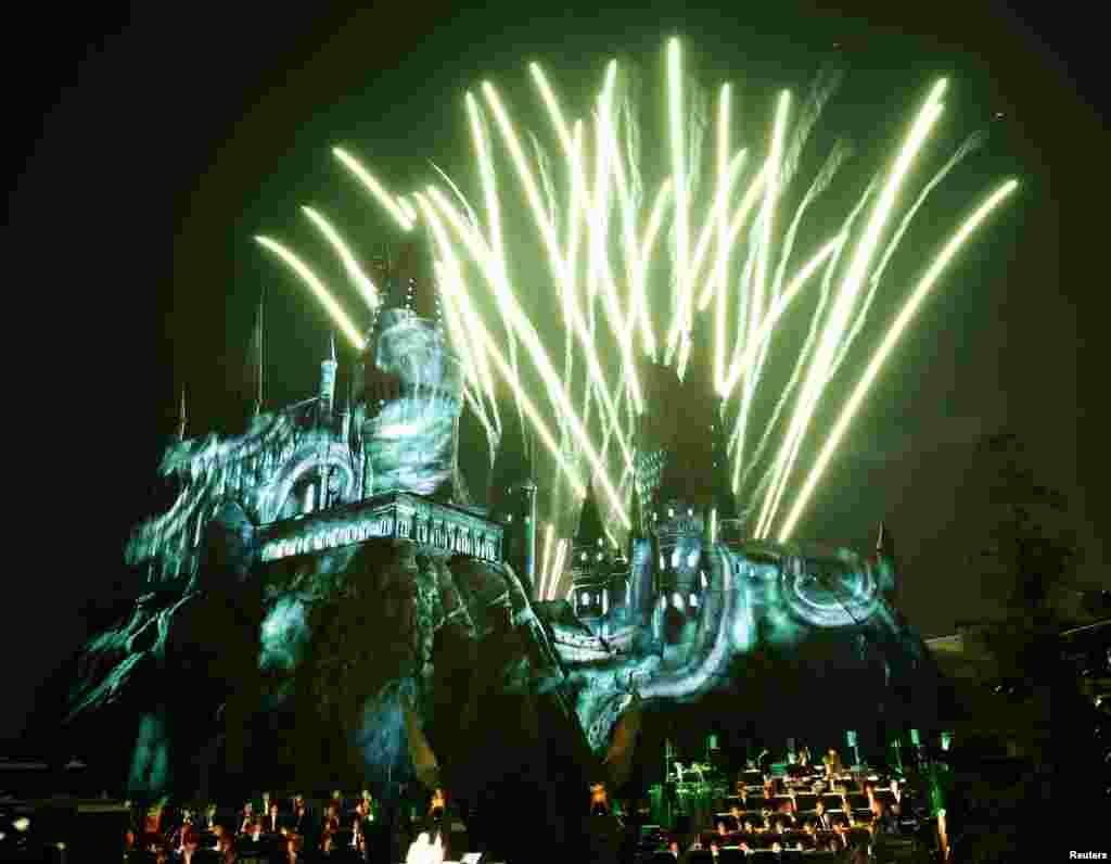 Fireworks explode over a reproduction of Hogwarts Castle, as the Los Angeles Philharmonic performs under the direction of composer John Williams, during a special preview opening of &quot;The Wizarding World of Harry Potter&quot; attraction at Universal Studios Hollywood in University City, California, April 5, 2016.