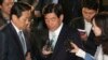Former National Intelligence Service director Won Sei-hoon, center, leaves Supreme Prosecutors' Office, in Seoul, South Korea, (File photo).