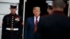 President Donald Trump walks out of the White House to greet South Korean President Moon Jae-in and his wife, April 11, 2019, in Washington.