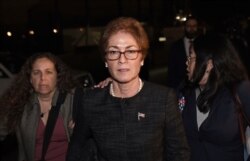 Former US Ambassador to Ukraine Marie Yovanovitch (C) flanked by lawyers, aides and Capitol police, leaves the US Capitol October 11, 2019 in Washington, DC after testifying behind closed doors to the House Intelligence, Foreign Affairs and…