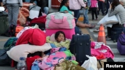 Venezuelan children sleep at the Binational Border Service.