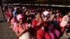 FILE PHOTO - Garment workers clap as they listen to Prime Minister Hun Sen speak at their factory outside of Phnom Penh, Cambodia, Wednesday, Aug. 30, 2017. 