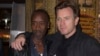 Actor and director Don Cheadle, left, poses for photographers with fellow actor Ewan McGregor at the screening of "Miles Ahead," in London, April 5, 2016.