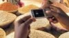 FILE – This undated file photo shows how farmers and foodies can use technological innovations to connect with other farmers and foodies.