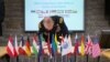 FILE - Gen. Martin E. Dempsey, chairman of the U.S. Joint Chiefs of Staff, signs a guestbook prior to starting a meeting at the NATO Cyber Defense Center of Excellence in Tallinn, Estonia, Sep. 14, 2015. (DoD photo by D. Myles Cullen/Released)
