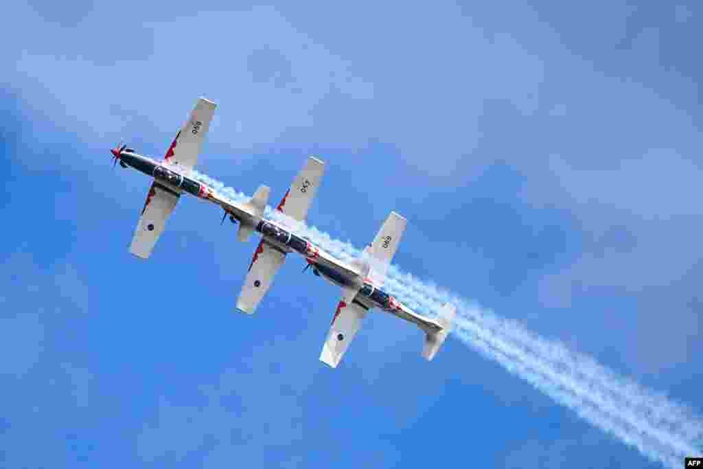 &lsquo;Wings of Storm&rsquo; formation pilots of the Croatian Air Force perform with their PC-9M aircraft during the International Air Show at the Hungarian Air Force base in Kecskemet, southern Hungary.