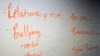 FILE - The board in a classroom is shown with key words during a Youth Aware of Mental Health session at Uplift Hampton Preparatory School in Dallas, Nov. 15, 2018.