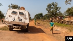 FILE - A United Nations armored personnel carrier patrols in Paoua, Central African Republic, Dec. 5, 2021.