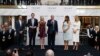 FILE - Then-candidate Donald Trump, accompanied by his family, speaks during the grand opening of the Trump International Hotel-Old Post Office, Washington, Oct. 26, 2016. Experts on government ethics warned Trump that he’d never shake suspicions of a clash between his private interests and the public good if he didn't sell off his vast holdings.