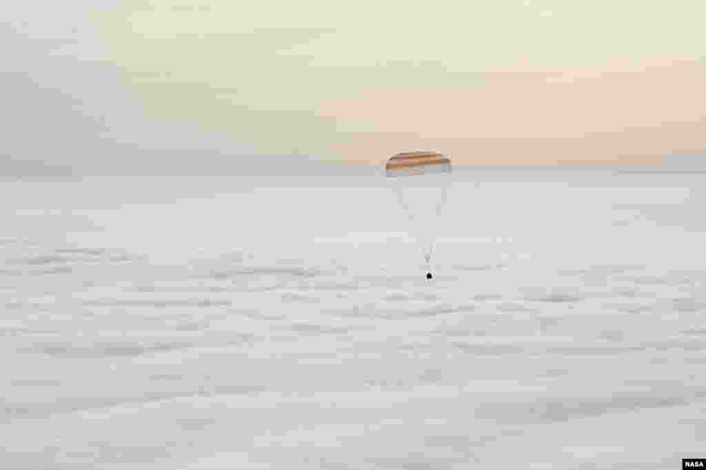 The Soyuz TMA-18M spacecraft is seen as it lands with Expedition 46 Commander Scott Kelly of NASA and Russian cosmonauts Mikhail Kornienko and Sergey Volkov of Roscosmos near the town of Zhezkazgan, Kazakhstan.