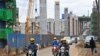 Motorists drive on Mombasa road, next to the ongoing construction site of the Nairobi Expressway, undertaken by the Chinese contractor China Road and Bridge Corporation (CRBC), in Nairobi, Kenya, July 12, 2021.