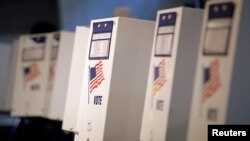FILE - Voting booths are seen in New York primary elections at a polling station in the Brooklyn borough of New York City, April 19, 2016.