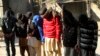 FILE - Pakistani suspects allegedly associated with the Islamic State group, wait to appear in an anti-terrorism court in Gujranwala, Pakistan, Dec. 29, 2015.