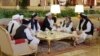 Members of the Taliban delegation are seen at the Sheraton Doha, before the start of the intra-Afghan dialogue, in Doha, Qatar, July 7, 2019.