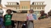 A group of supporters called for the release of Rath Rott Mony, an RT fixer, in front of the Phnom Penh Municipal Court, Phnom Penh, Cambodia, May 30, 2019. (Hul Reaksmey/VOA Khmer)