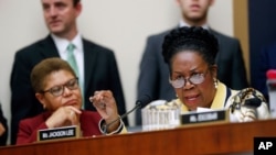 FILE - U.S. Representative Sheila Jackson Lee, right, speaks about reparations for the descendants of slaves before the House Judiciary Subcommittee on the Constitution, Civil Rights and Civil Liberties, in Washington, June 19, 2019. Her family posted on Friday that she has died.