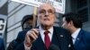 FILE - Rudy Giuliani speaks during a news conference outside federal court in Washington, Dec. 15, 2023. 