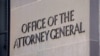 FILE - A sign of the Office of the Attorney General is displayed on the Department of Justice building the day after Special Counsel Robert Mueller delivered his report into Russia's role in the 2016 U.S. election, March 23, 2019. 