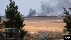 Slomljena kapija kibuca Kfar Aza kroz koju su palestinski militanti navodno ušli, na jugu Izraela na granici s pojasom Gaze 10. oktobra 2023.