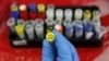 A health technician shows a blood sample from a patient bitten by a mosquito at the National Institute of Health in Lima, Peru, Feb. 2, 2016. 