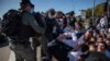 Israeli police officers clash with ultra-Orthodox Jews in Ashdod, Israel, Jan. 24, 2021.