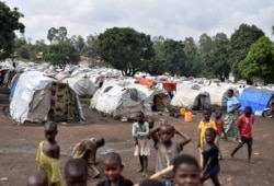 FILE - Victims of ethnic violence are seen at a makeshift camp for the internally displaced people in Bunia, Ituri province in the eastern Democratic Republic of Congo, June 25, 2019.