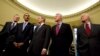 President George W. Bush hosts President-elect Barack Obama, and former presidents, from left, George H.W. Bush, Bill Clinton and Jimmy Carter, Jan. 7, 2009, in the Oval Office of the White House in Washington.