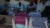 FILE - Tailors make face masks at the Tayamba Tailoring shop, which has embarked in the business of producing face masks intended to protect against the COVID-19 coronavirus, in Lilongwe, Malawi, May 4, 2020.