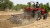 FILE - A farmer plows the field in Saulawa village, on the outskirts of Nigeria&#39;s north-central state of Kaduna.